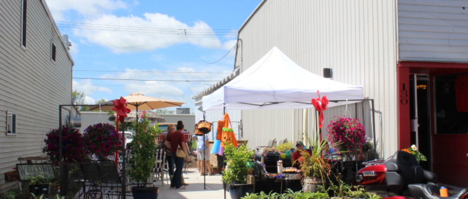 Red Daisy Girl opened the doors today! The outdoor patio is gorgeous! Welcome to "Main Street"!